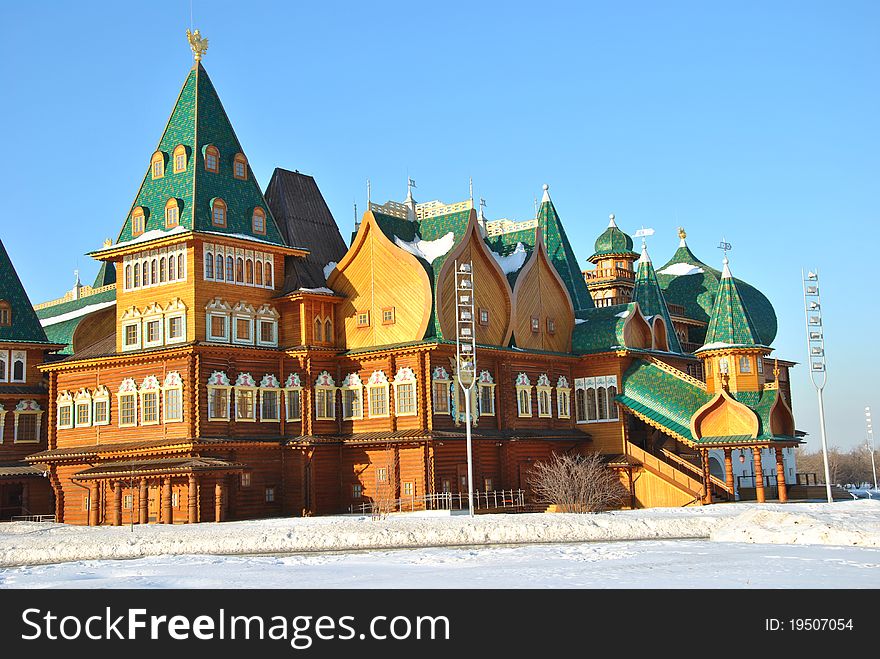 Wooden palace of Tsar Alexei Mikhailovich in Moscow in traditional Russian style at the background of a winter park. Wooden palace of Tsar Alexei Mikhailovich in Moscow in traditional Russian style at the background of a winter park.