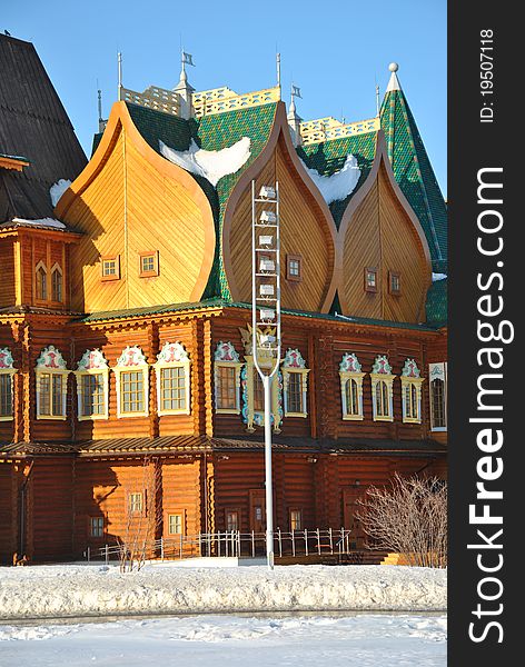 Wooden palace of Tsar Alexei Mikhailovich in Moscow in traditional Russian style at the background of a winter park. Wooden palace of Tsar Alexei Mikhailovich in Moscow in traditional Russian style at the background of a winter park.