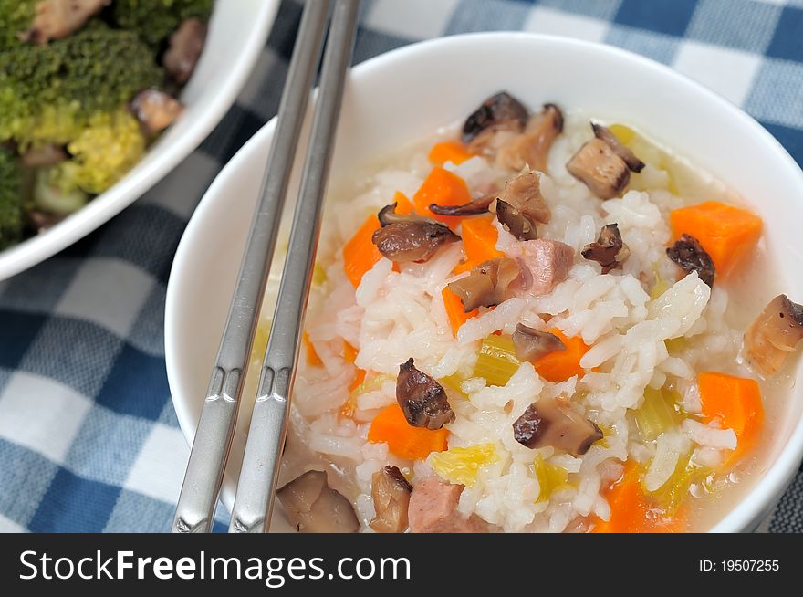 Asian style healthy mixed vegetable porridge in white bowl. Asian style healthy mixed vegetable porridge in white bowl.