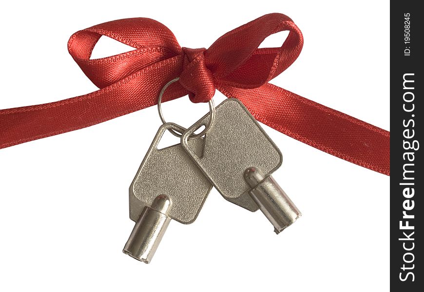 Two metal keys with bow over white, security concept. Two metal keys with bow over white, security concept