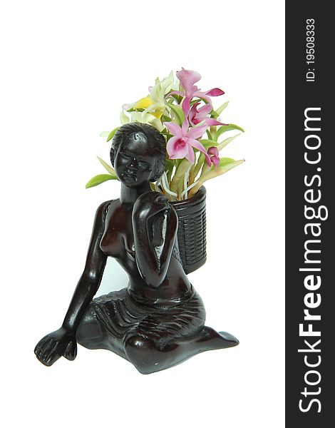 Wooden woman doll with orchid flower on her back