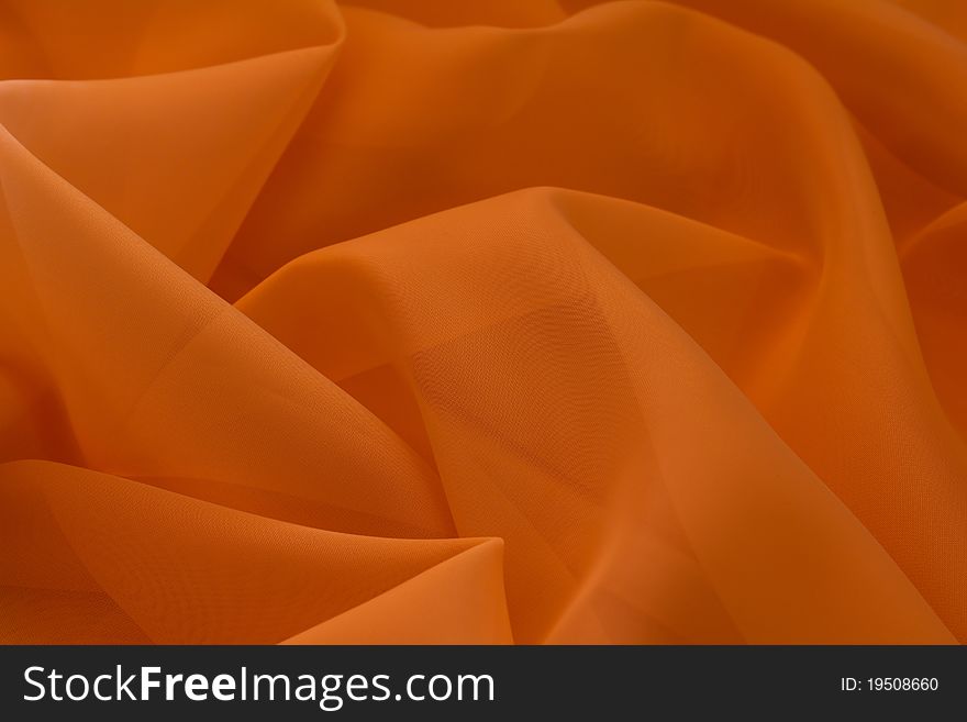Abstract background from orange fabric. Abstract background from orange fabric