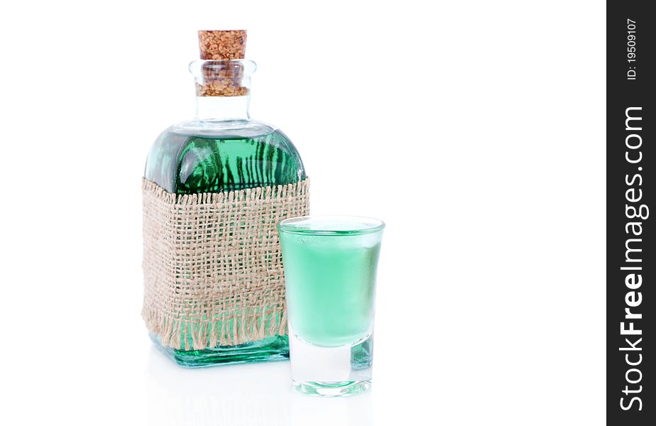 Glass of liqueur / mint drink and bottle. isolated on a white background. Glass of liqueur / mint drink and bottle. isolated on a white background