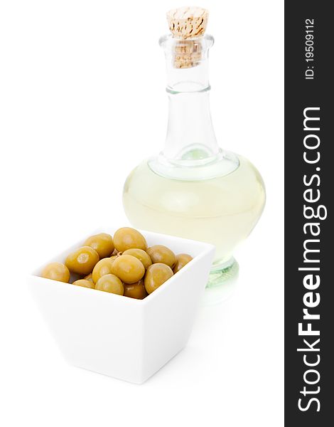 Decanter of oil and olives, isolated on white background. Decanter of oil and olives, isolated on white background