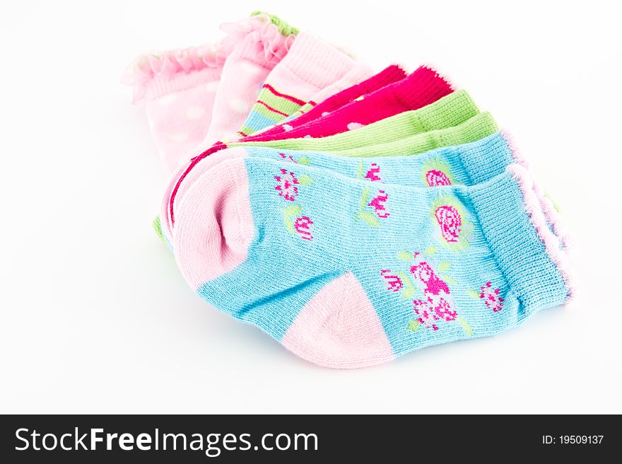Set of baby colorful socks isolated on white