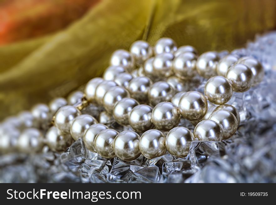 Elegant pearls over ice with ribbon