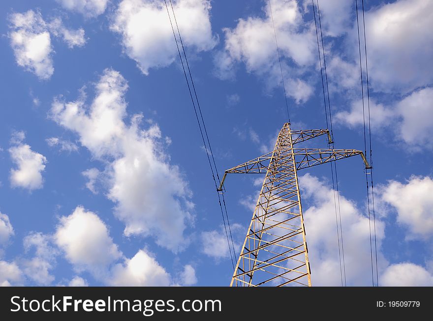 High-voltage electricity wires and poles in the background of clouds. High-voltage electricity wires and poles in the background of clouds.