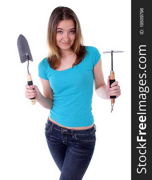 Woman holding a gardening shovel and hoe. Woman holding a gardening shovel and hoe