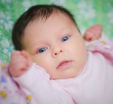 Beautiful Baby Girl Is Lying In A Bed. Royalty Free Stock Images Beautiful Baby Girl Is Lying In A Bed. Royalty Free Stock Images