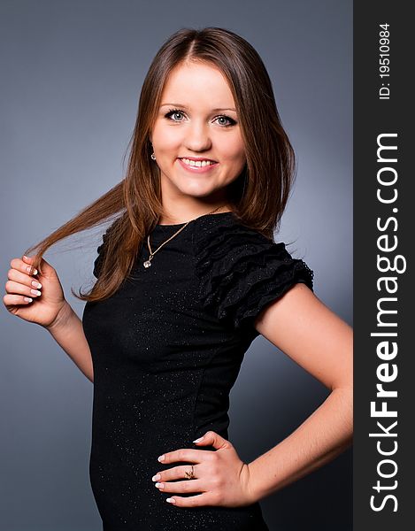 Studio portrait of a young beautiful girl smiling. Studio portrait of a young beautiful girl smiling