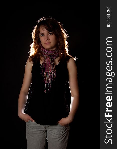 Woman portrait with pink scarf on black background