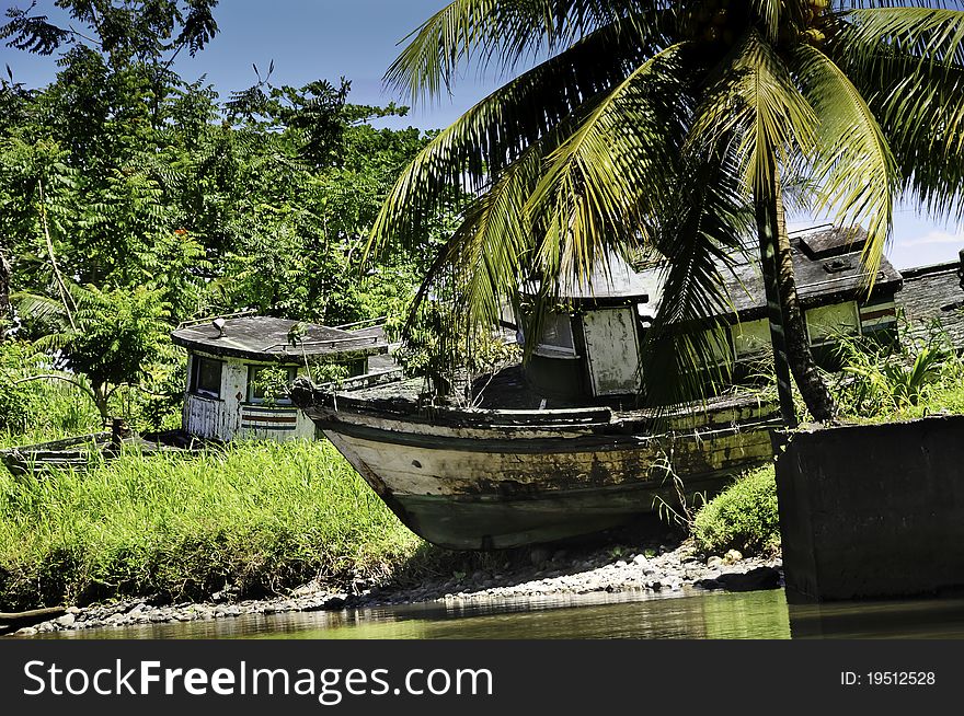 Two old abandoned boats on a tropical isle. Two old abandoned boats on a tropical isle