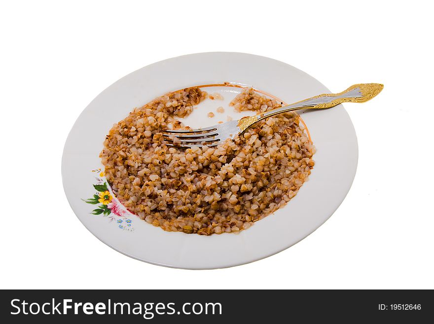 Plug with a bowl in which the prepared buckwheat lies(isolated). Plug with a bowl in which the prepared buckwheat lies(isolated)