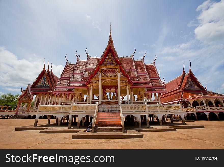 Buddhist temple with blue sky in Thailand.