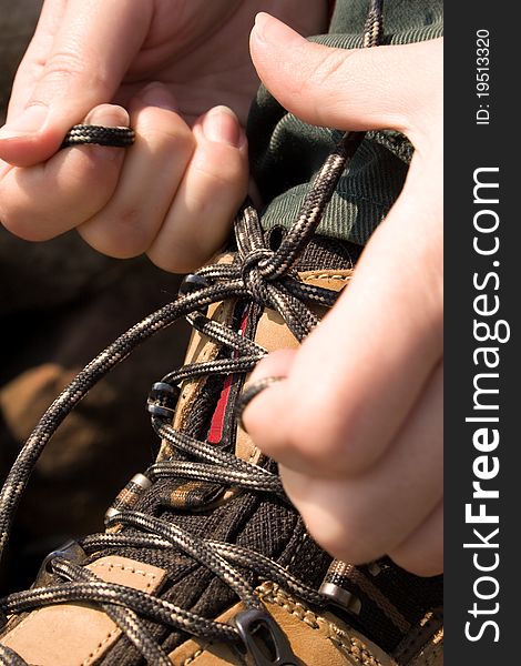 Rock boot with hands in forest