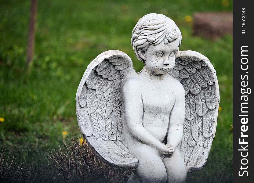 A stone angel child found in a cemetary
