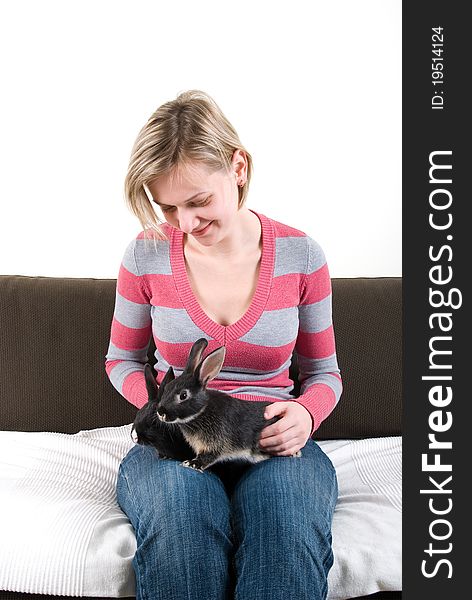 Young woman with two bunnies on her laps. Young woman with two bunnies on her laps