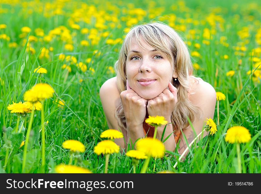 Blonde Woman On The Grass