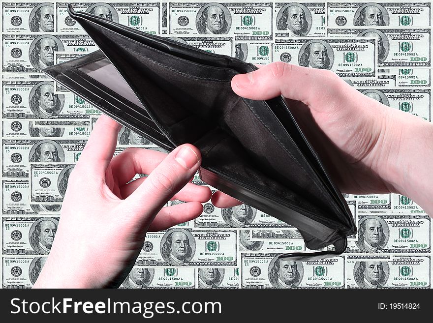 Hands holding an empty wallet with dollar bills in the background. Hands holding an empty wallet with dollar bills in the background