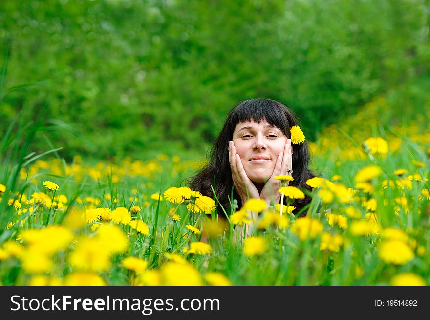 Young pretty woman on the green grass. Young pretty woman on the green grass