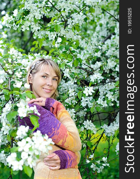 Woman in the blooming tree