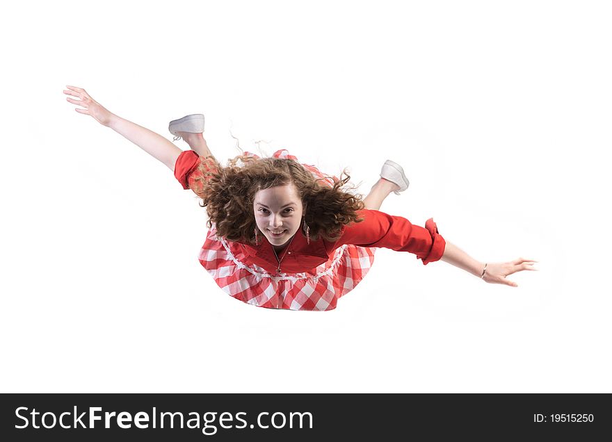 Levitation - youth girl flying in studio isolated over white
