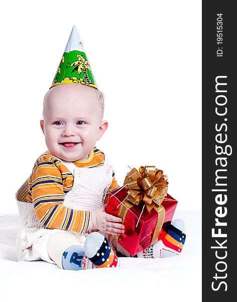 Cheerful kid with a gift in the hands. Cheerful kid with a gift in the hands