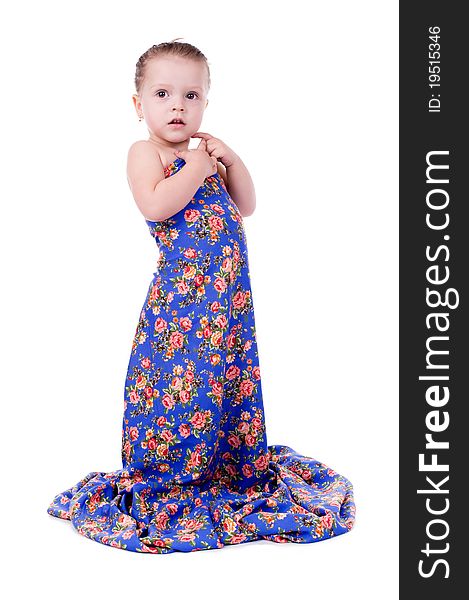 Little girl in a bright dress isolated on a white background.