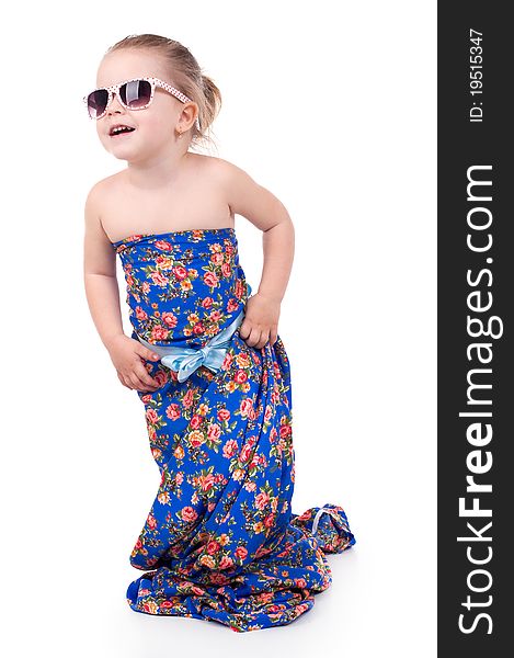 Little girl in a bright dress isolated on a white background.