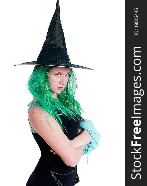 Portrait of a girl dressed as a witch isolated on a white background