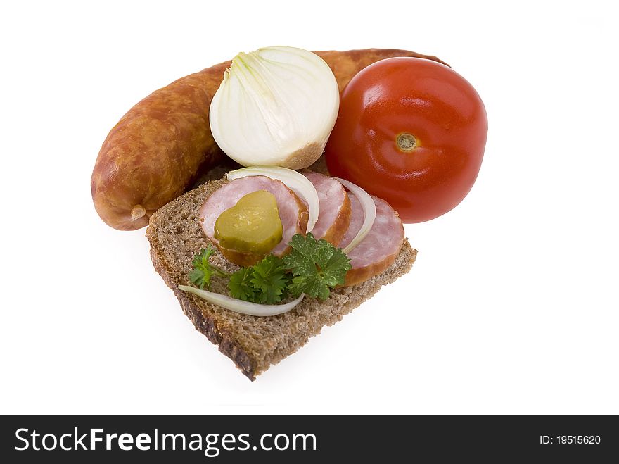 Fresh pork sausage with bread, cucumber, onion,tomato