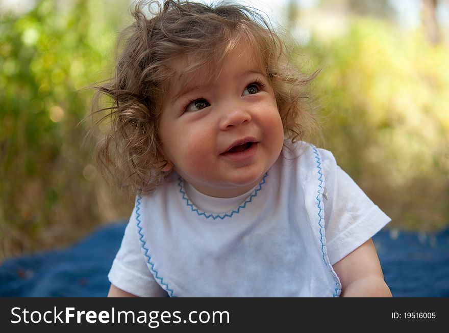 Portrait of a young boy with curly hair. Portrait of a young boy with curly hair.