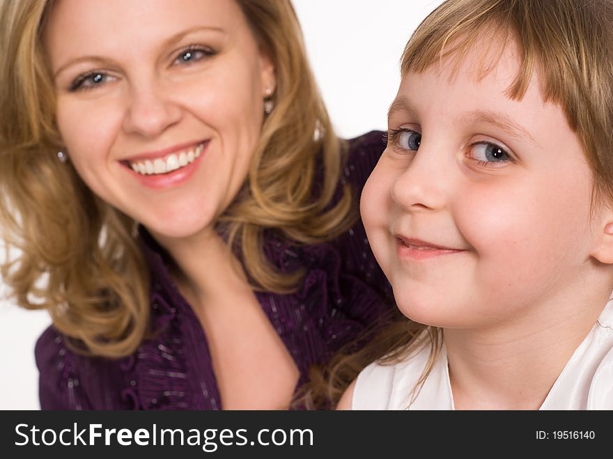 Mom with her daughter on a white background. Mom with her daughter on a white background
