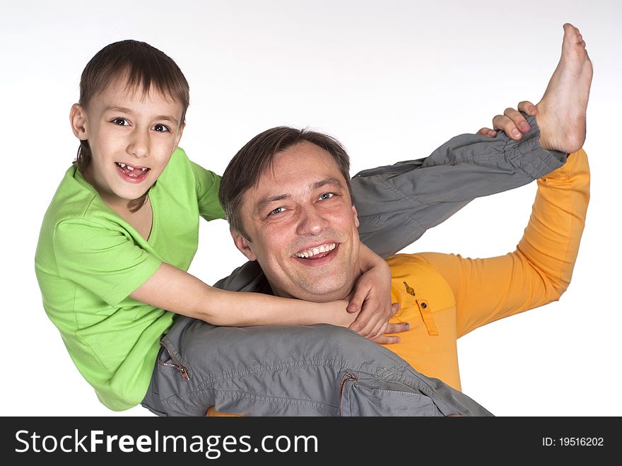 Happy dad and his son standing on a white background. Happy dad and his son standing on a white background
