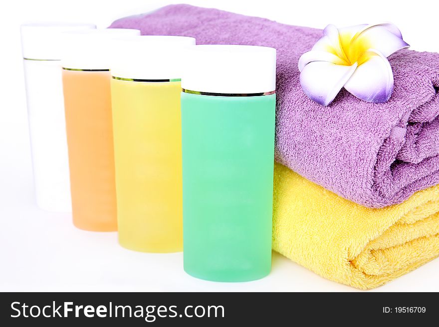 Towels, flower and cosmetics. Beauty spa concept. Towels, flower and cosmetics. Beauty spa concept