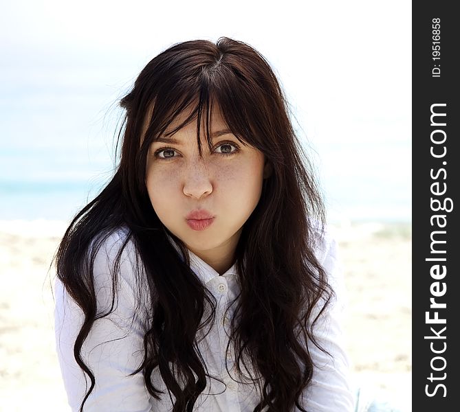 Girl lighten up at the beach in spring