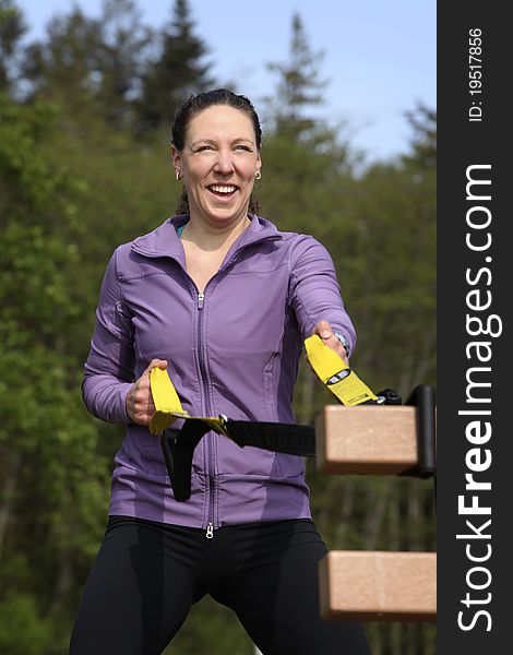 Women exercising with sports equipment outdoors. Women exercising with sports equipment outdoors