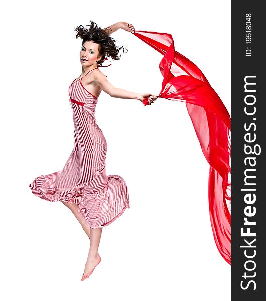 Young beautiful woman jumping with a scarf. Young beautiful woman jumping with a scarf