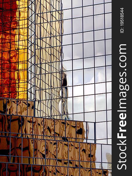 Gold tinted reflections, patterns in office tower glass. Gold tinted reflections, patterns in office tower glass.