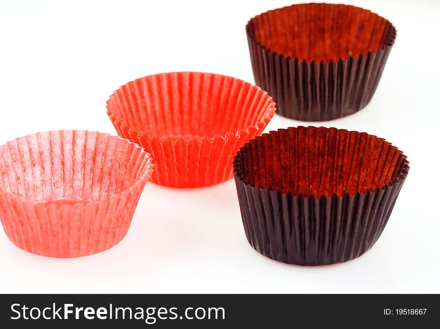 Colorful papers for baking cup cakes isolated over white Photo taken on: 2011.5.15