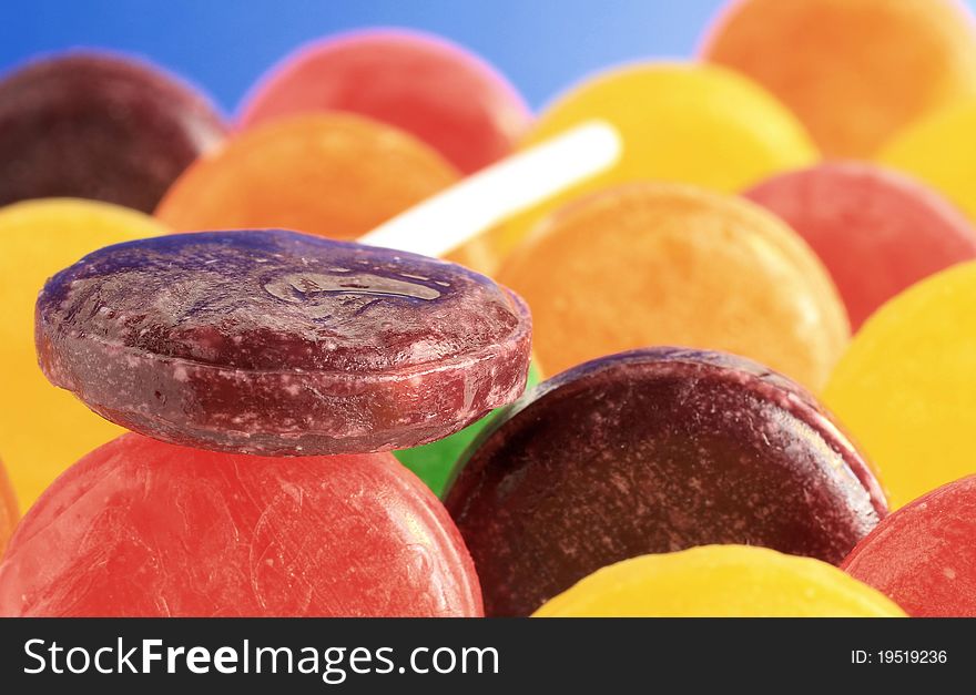 Very colorful image of a lollipop atop other colorful lollipop's. Very colorful image of a lollipop atop other colorful lollipop's