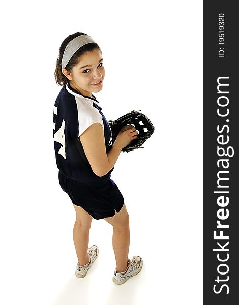 An attractive young teen happily sitting on an old bench wearing her team's softball uniform. She holds a new mitt and a well worn ball. An attractive young teen happily sitting on an old bench wearing her team's softball uniform. She holds a new mitt and a well worn ball.