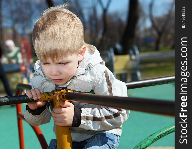 Young Boy Walks In The Park