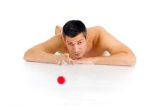 Bare-chested Man Lying On The Floor Playing With M Stock Image