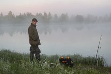 Fisherman On A Morning Foggy Lake Royalty Free Stock Photos Fisherman On A Morning Foggy Lake Royalty Free Stock Photos