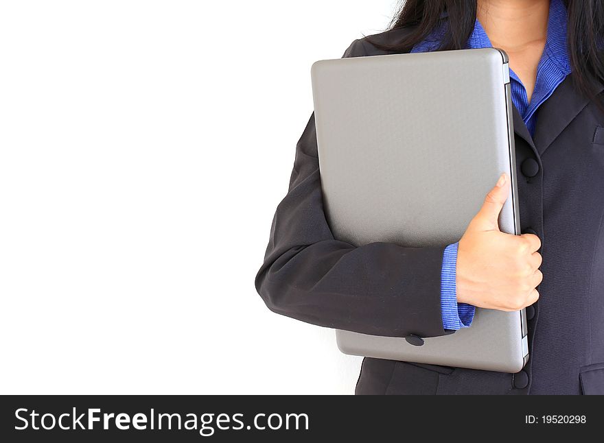 Closeup portrait of young business woman holding a laptop on head isolated on white background. Closeup portrait of young business woman holding a laptop on head isolated on white background