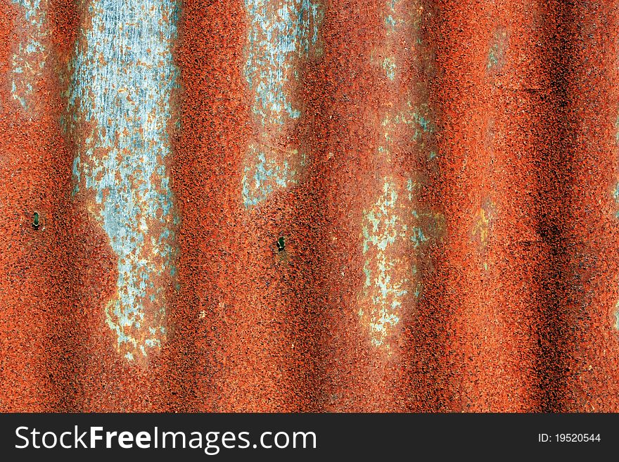An old rusty Corrugated Iron Fence