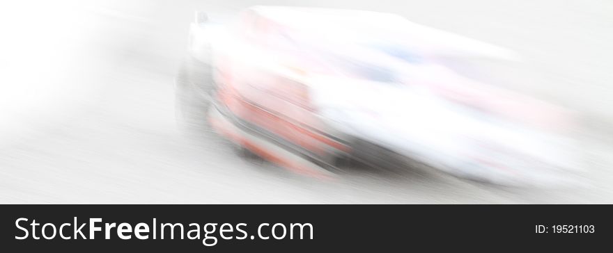 Abstract of a race car turning into the lap. Abstract of a race car turning into the lap.