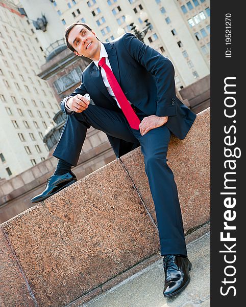 Young successful businessman portrait in modern downtown. Young successful businessman portrait in modern downtown
