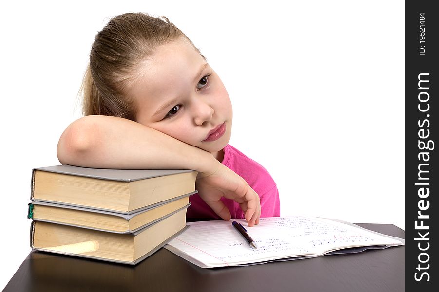 The schoolgirl does homework. Tired.